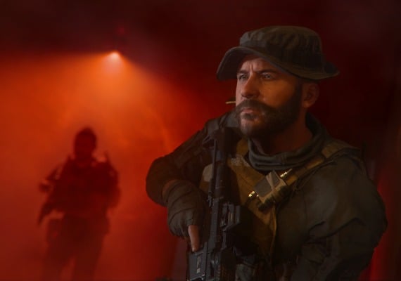 Call of Duty: Modern Warfare III - Captain Price in Intense Combat Scene Close-up of a bearded soldier in tactical gear and boonie hat from Call of Duty: Modern Warfare. He looks alert, facing right. Red atmospheric lighting dominates the scene. A silhouette of another armed figure is visible in the background.